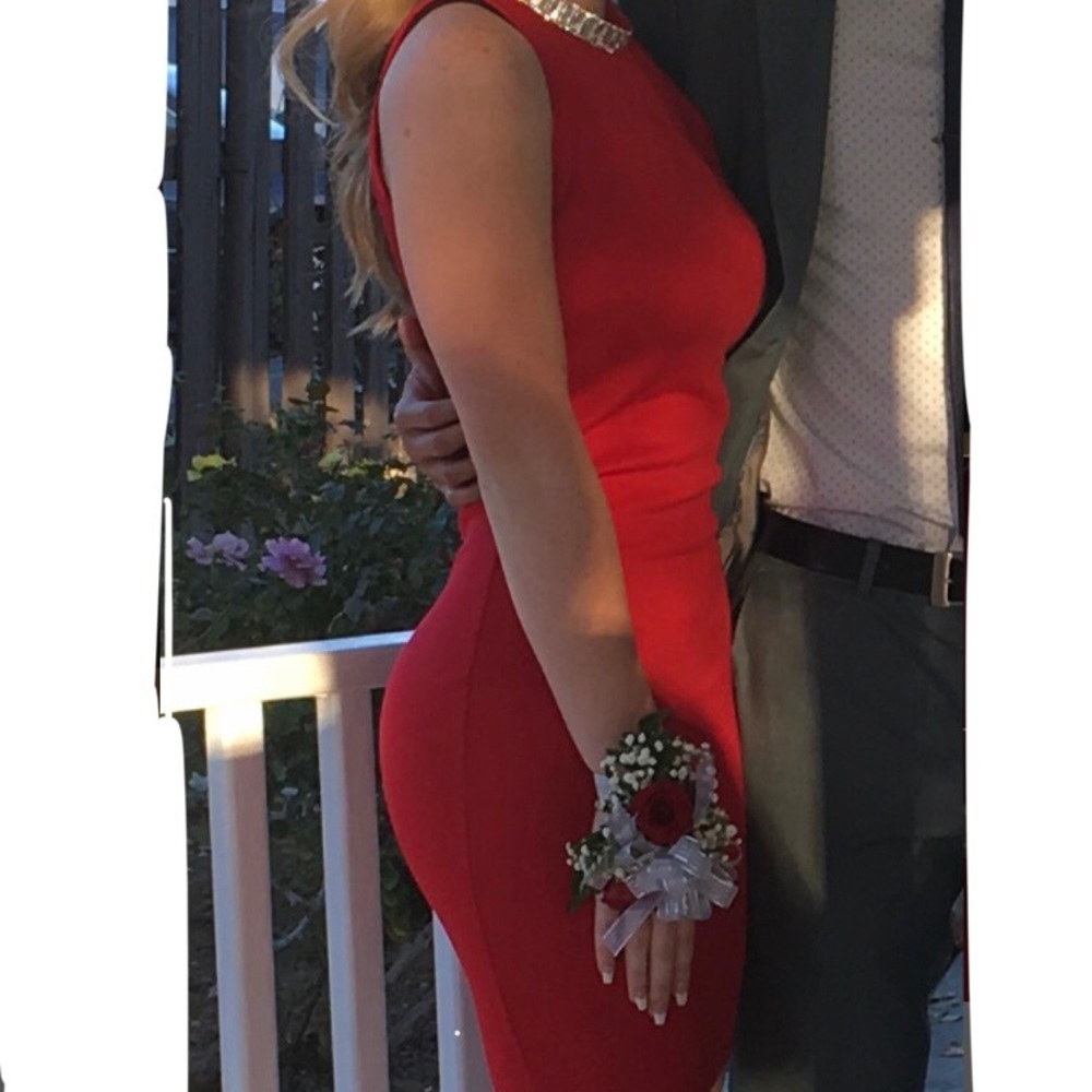 Bright red sleeveless dress with jeweled collar